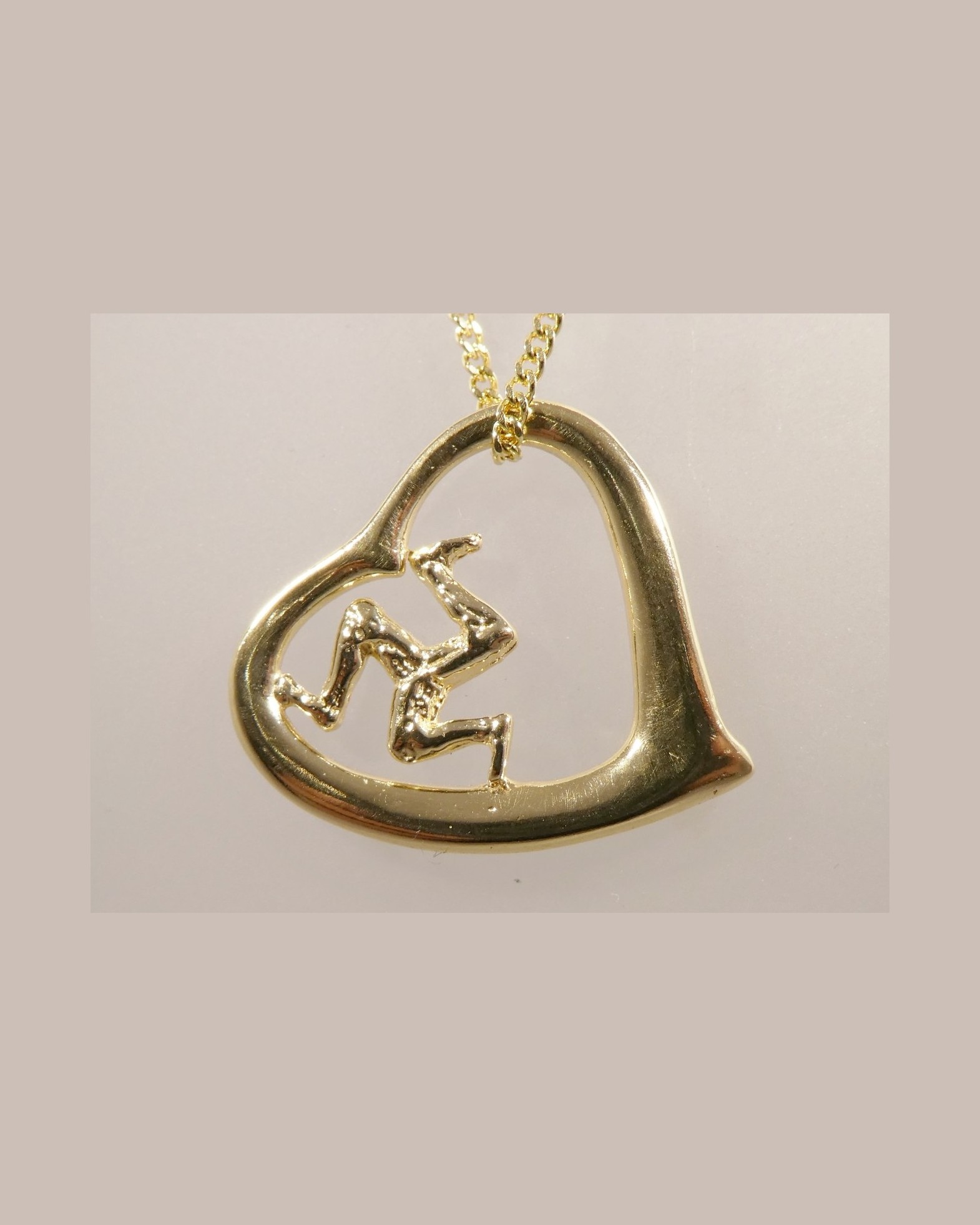 Three legs of Man heart pendant