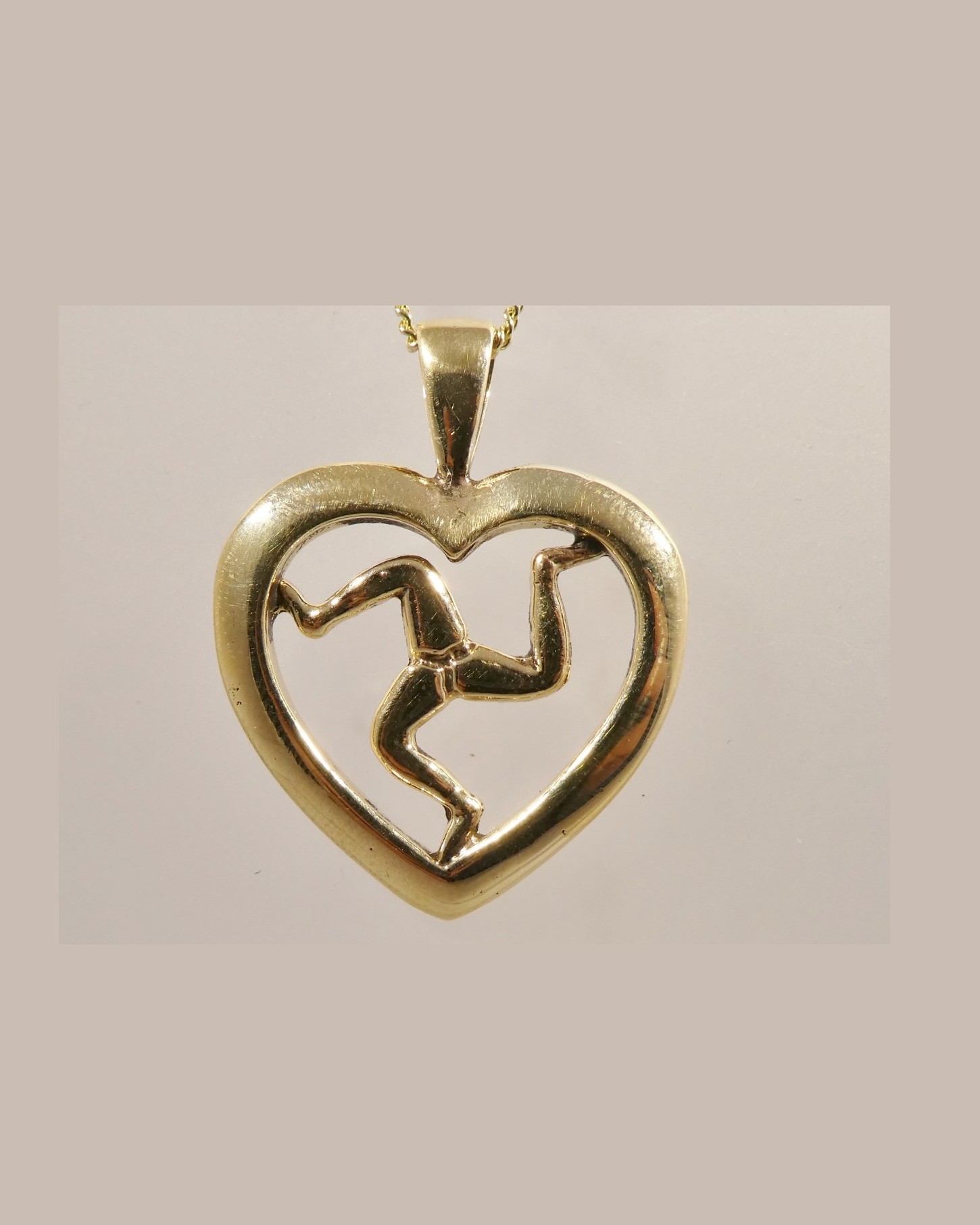 Three legs of Man heart pendant